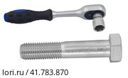 Торцевой гаечный ключ с болтом на белом фоне. Socket wrench with bolt on white background. Стоковое фото, фотограф Татьяна Д / Фотобанк Лори