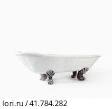 white vintage ceramic bathtub handmade on light background. Стоковое фото, фотограф Артем Курутин / Фотобанк Лори