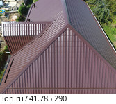 A view from above on the roof of the house. The roof of corrugated sheet. Roofing of metal profile wavy shape. Стоковое фото, фотограф Леонид Еремейчук / Фотобанк Лори