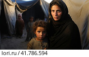 Portrait of Refugees on middle east looking at camera. Homeless people, unhappy and frightened, shawl camps,  Generative AI. Стоковое AI-изображение, AI-художник Анна Кривицкая / Фотобанк Лори