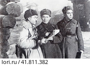 Командир 8-й гвардейской (316-й) стрелковой дивизии генерал-майор И. В. Панфилов (слева), начальник штаба дивизии полковник И. И. Серебряков и военком дивизии старший батальонный комиссар С. А. Егоров на рекогносцировке в деревне Гусенево. Последний снимок генерал-майора Ивана Панфилова - 18.11.1941, в этот день он погиб. Редакционное фото, фотограф Сергей Елизарьев / Фотобанк Лори