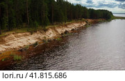 Surrendering Shore, Pines Adrift, Reservoir Surge Under Cumulus Patchwork. Aerial Drone Shot. Стоковое видео, видеограф Даниил Хабаров / Фотобанк Лори