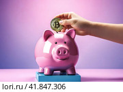 Рука кладет биткоин-монету в копилку. Стоковое AI-изображение, AI-художник Александр Бушков / Фотобанк Лори