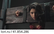 Spanking young alluring woman in wells for punishment. Стоковое видео, видеограф Гурьянов Андрей / Фотобанк Лори