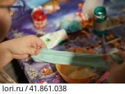 Photography of slime preparation. Master Class. Children' hands. Concepts of education, skills  development, game and childhood. Стоковое фото, фотограф YuryKara / Фотобанк Лори