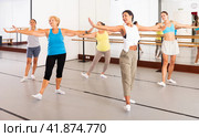 Group of active women practicing energetic dance in a studio. Стоковое фото, фотограф Яков Филимонов / Фотобанк Лори