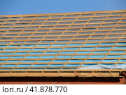 Construction of the roof of a new house. Wooden bars and vapor barrier. Стоковое фото, фотограф Леонид Еремейчук / Фотобанк Лори