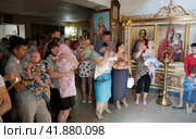Russia Samara June 25, 2011: Orthodox parishioners came to baptize their babies in the church. Редакционное фото, фотограф Акиньшин Владимир / Фотобанк Лори