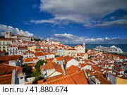View of Lisbon from Miradouro de Santa Luzia viewpoint with moored cruise liner and moving clouds. Lisbon, Portugal. Стоковое фото, фотограф Дмитрий Рухленко / Фотобанк Лори