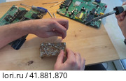 Close up Soldering a micro chip processor with iron tool on a green circuit boad. Electroncs service technology and macro computer concept background. Стоковое видео, видеограф Ирина Старикова / Фотобанк Лори