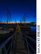 PLAYA BLANCA, LANZAROTE - OCTOBER 25, 2023: Evening on Marina Rubicon of Playa Blanca. Playa Blanca is the southernmost town of the Spanish island of Lanzarote. It is the newest resort on the island. Редакционное фото, фотограф Sergey Kohl / Фотобанк Лори