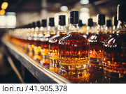 Automatic production line fills glass bottles with cognac. Стоковое AI-изображение, AI-художник Ирина Михайличенко / Фотобанк Лори