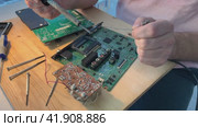 Close up Soldering a micro chip processor with iron tool on a green circuit boad. Electroncs service technology and macro computer concept background. Стоковое видео, видеограф Ирина Старикова / Фотобанк Лори