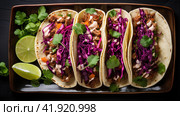 Row of Mexican street Tacos on slate with carne asada and al pastor in corn tortilla. Стоковое AI-изображение, AI-художник Ирина Ручушкина / Фотобанк Лори