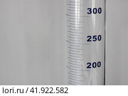 Chemical flask with milliliter marks close up. Стоковое фото, фотограф Аксенова Вера / Фотобанк Лори