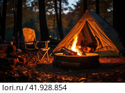 Beautiful bonfire with burning firewood near chairs and camping tent in forest. Стоковое AI-изображение, AI-художник Ирина Михайличенко / Фотобанк Лори