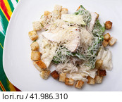 Malibu salad with crab sticks and croutons, feta cheese and vegetables. Asian style. Стоковое фото, фотограф Abakumova Ekaterina / Фотобанк Лори