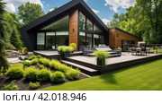 modern home with a striking angular design features a beautiful wooden deck and lush landscaping. Стоковое AI-изображение, AI-художник Юлия Гапеенко / Фотобанк Лори