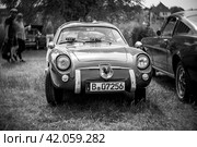 WERDER (HAVEL), GERMANY - MAY 20, 2023: The sport car Fiat-Abarth 750 Zagato "Double Bubble". Swirl bokeh, art lens. Black and white. Oldtimer - Festival Werder Classics 2023. Редакционное фото, фотограф Sergey Kohl / Фотобанк Лори