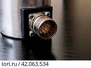 Metal encoder on a black wooden table. Стоковое фото, фотограф Аксенова Вера / Фотобанк Лори