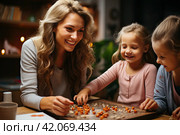 Smiling mother and little children playing logic strategy wooden board game at kitchen table together, caring mom teaching adorable kid girl, happy family engaged in educational activity at home. Стоковое AI-изображение, AI-художник Ирина Михайличенко / Фотобанк Лори