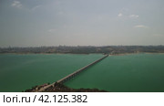 Bridge over a Lake Catalan and Passing Cars. Adana. Turkey. Стоковое видео, видеограф ILIA GOROKHOV / Фотобанк Лори