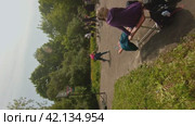 Cherepovets, Russia - May 27, 2023, Kids playing street basketball. FPV Aerial Drone Shot. Vertical. Стоковое видео, видеограф Даниил Хабаров / Фотобанк Лори