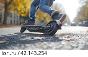 Man falling off an electric scooter. Стоковое AI-изображение, AI-художник Кирилл Черезов / Фотобанк Лори