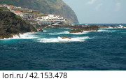 Madeira Island. Panoramic view of the rocky ocean shoreline with beach infrastructure in the vicinity of Funchal. Copy space. Стоковое фото, фотограф Роман Дзюбало / Фотобанк Лори