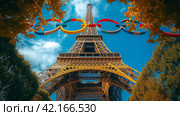 The Olympic rings and the Eiffel tower. Summer Olympic games concept. Стоковое AI-изображение, AI-художник Ирина Михайличенко / Фотобанк Лори