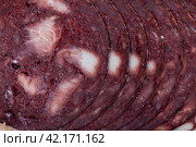European cuisine blood pudding on white plate on wooden table. Стоковое фото, фотограф Яков Филимонов / Фотобанк Лори