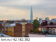 Amazing roof view of old buildings and a modern skyscraper. The tallest building in Europe. City skyline of Saint Petersburg, Russia. Стоковое фото, фотограф Андрей Степанов / Фотобанк Лори