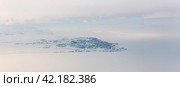 Panorama of the northern port town in the Arctic. Winter aerial view of the city of Anadyr, located on the coast of the Anadyr estuary, in the Far North of Russia. Chukotka, Siberia, Russian Far East. Стоковое фото, фотограф Андрей Степанов / Фотобанк Лори