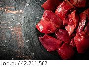 Pieces of raw liver on a stone tray with salt. Стоковое фото, фотограф Артем Шадрин / Фотобанк Лори