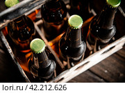 Beer bottles in an old box. Стоковое фото, фотограф Артем Шадрин / Фотобанк Лори