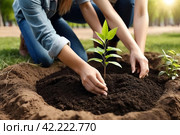 Young people in work uniform with shovel plant tree sapling in ground. Background for gentrification of territory. Concept of landscaping, nature, environment and ecology. Copy space. Стоковое AI-изображение, AI-художник Aleksandr Golubev / Фотобанк Лори