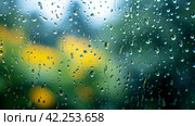 Glistening raindrops on windowpanes create a soothing, minimalist spring setting. Стоковое AI-изображение, AI-художник Юлия Гапеенко / Фотобанк Лори