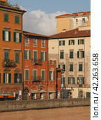 Pisa, Italy - September 15 2008: Pisa cityscape in day. The Tuscany region, central Italy, straddling the Arno river. Travel and touristic concepts. Редакционное фото, фотограф YuryKara / Фотобанк Лори