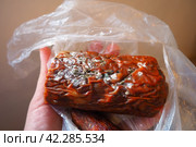 Raw smoked sausage became moldy while it was in a plastic bag. A mold or mould. The dust-like, colored appearance of molds is due to the formation of spores containing fungal secondary metabolites. Стоковое фото, фотограф Юлия Петровская / Фотобанк Лори