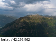 View of the Great Caucasian Ridge opening from the Upper station of the cable car system of the Dombay ski resort on a summer day, Karachay-Cherkessia, Russia. Стоковое фото, фотограф Ula Ulachka / Фотобанк Лори