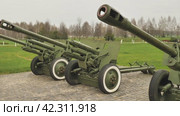 Three 76-mm ZIS-3 howitzer guns. An exhibition of World War II military equipment in a park in Belarus. The most massive Soviet cannon from the Second World War. Стоковое видео, видеограф Воловодов Владимир / Фотобанк Лори