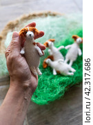Knitted dogs jack russell terier toy with yarn and knitting accessories. Стоковое фото, фотограф Анатолий Типляшин / Фотобанк Лори