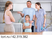 Displeased mother and father reprimanding eldest teenage daughter. Стоковое фото, фотограф Яков Филимонов / Фотобанк Лори