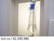 Dropper, medical bag for injecting fluid into a vein, Стоковое фото, фотограф Evgenii Predibailo / Фотобанк Лори