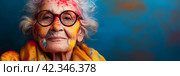 Background for Holi holiday, voluminous and airy colored powder on the face of an elderly old woman and empty space for design. Banner. Стоковое AI-изображение, AI-художник Мария Фадеева / Фотобанк Лори