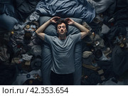 Sleep-deprived Man suffering from insomnia on bed. Generate Ai. Стоковое AI-изображение, AI-художник Иван Рябоконь / Фотобанк Лори