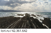 Picturesque seascape in Basque Autonomous Community / country in summer cloudy day. Wide Atlantic ocean coast at low tide in Bay of Biscay. Charming Zumaia Itzurun beach. High resolution image. Стоковое фото, фотограф YuryKara / Фотобанк Лори