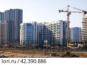 Belarus, Minsk - 07 february, 2024: Modern houses in Minsk world. Редакционное фото, фотограф Аксенова Вера / Фотобанк Лори
