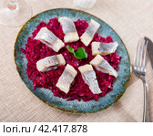 Nicely served sliced salted herring with beet salad on side. Стоковое фото, фотограф Яков Филимонов / Фотобанк Лори