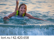 Portrait of a smiling child, a girl on an inflatable ring in the sea or pool. Стоковое фото, фотограф Светлана Семёновская / Фотобанк Лори